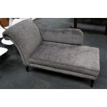 A modern chaise lounge by Jameson Furniture, in grey velvet, on black painted wooden legs, 162 x