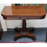 A Victorian mahogany card table, with 'D' shaped top, raised on fluted column support and platform