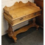 A pine wash stand, three quarter galleried top over short drawers, raised on turned supports, 94 H x