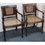 A pair of 19th century Anglo Indian rosewood armchairs, cane back an seat, turned legs.