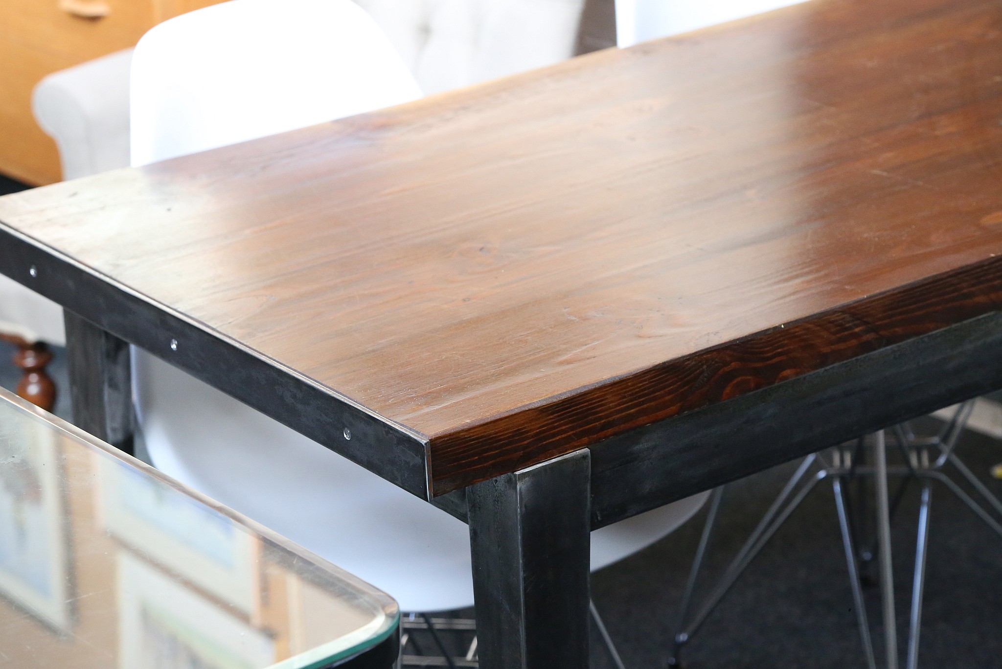 A Modern industrial style dining table with thick stained pine top, on steel base (137 x 69 x 75cm - Image 2 of 2