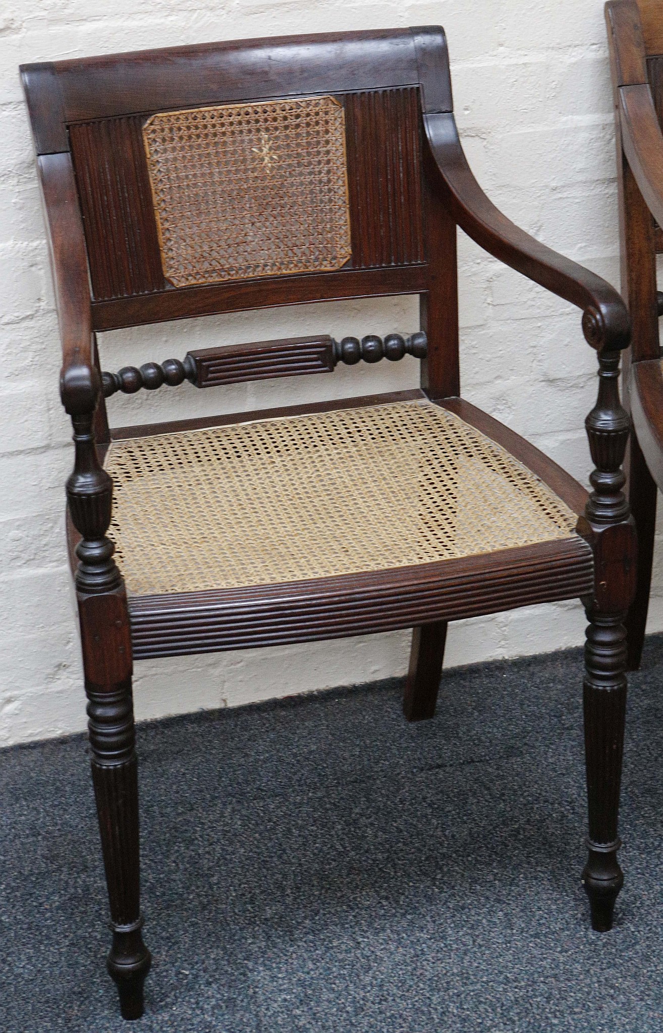 A pair of 19th century Anglo Indian rosewood armchairs, cane back an seat, turned legs. - Image 2 of 3