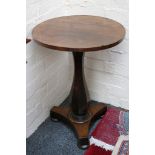 A small Victorian rosewood occasional table, with circular top on platform base, 43cm diameter.
