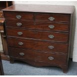 An early 19th century mahogany chest of 2 short over 4 long drawers on bracket feet.