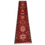 Persian Heriz runner, North West Iran, 4.22m x 0.88m. Condition rating A.