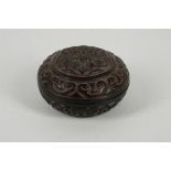 A JAPANESE GURI LACQUER CIRCULAR BOX AND COVER, KOGO. Meiji Period. Carved through layers of red and