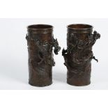 A PAIR OF JAPANESE CYLINDRICAL BRONZE VASES Meiji era. Of cylindrical form, decorated with dragons