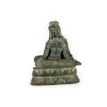 A SEATED BRONZE FIGURE. 8cm H.