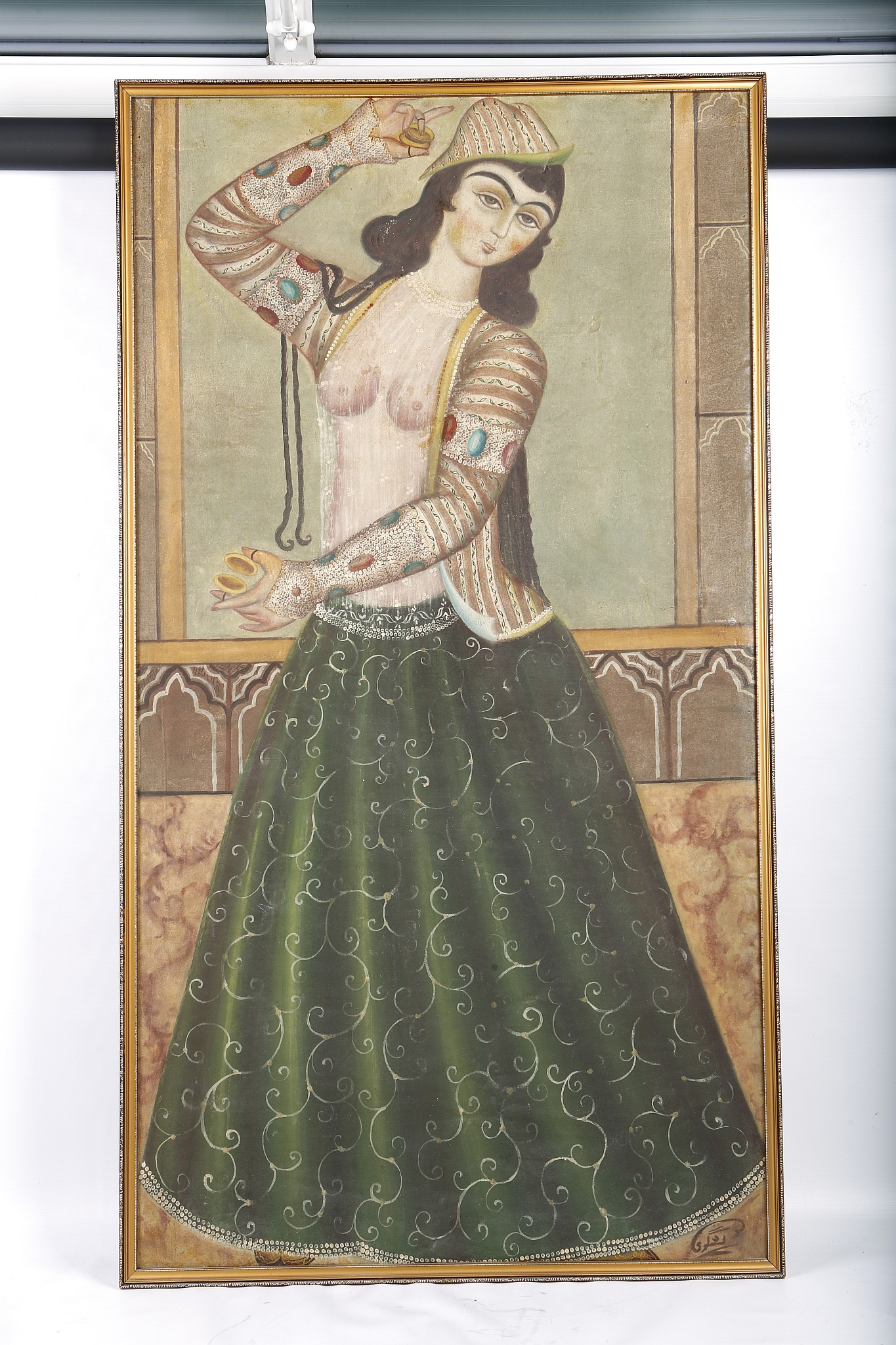 A QAJAR OIL PAINTING OF A LADY PLAYING CASTANETS. 19th Century. 145 x 79cm.