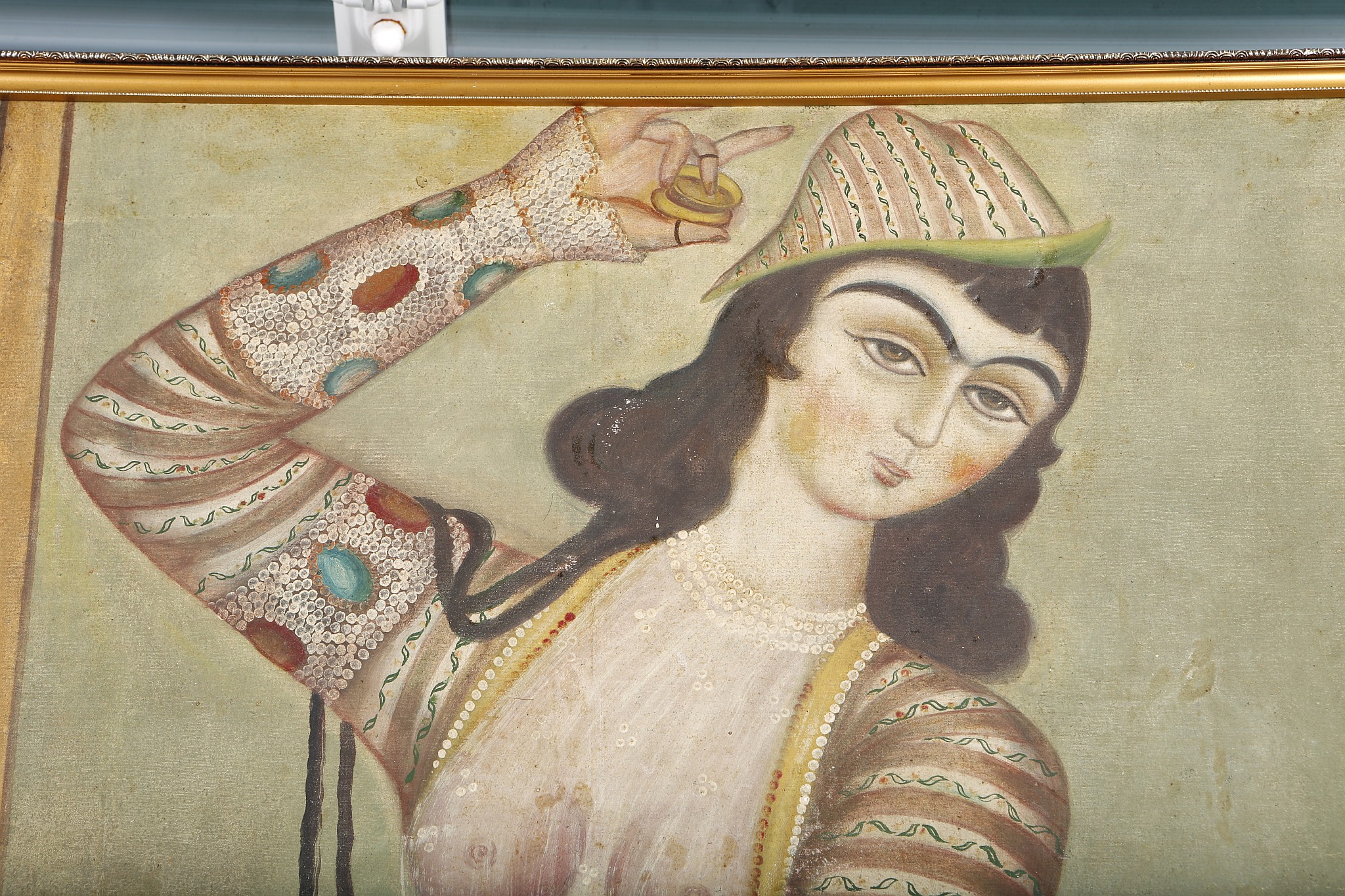 A QAJAR OIL PAINTING OF A LADY PLAYING CASTANETS. 19th Century. 145 x 79cm. - Image 2 of 4