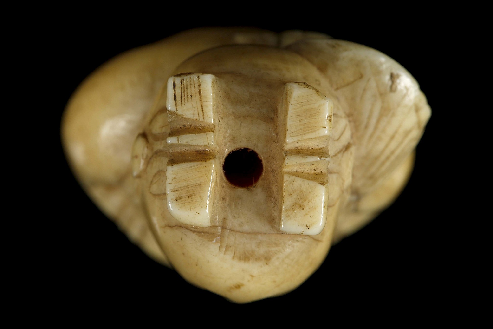 A JAPANESE IVORY NETSUKE FORMED AS A BOY. Meiji Period. Carved standing and holding a lotus - Image 5 of 6