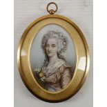 An oval portrait miniature of an elegant Regency lady in a silk dress adorned with a spray of