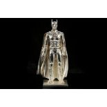A vintage Solid Sterling Silver Batman figurine cast in detail showing the character in full costume
