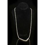 A single strand of graduated pearls with a 15ct diamond set clasp.