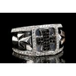 A gents 18ct white gold and diamond ring, set with
