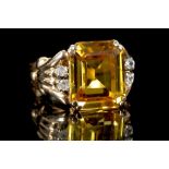 An 18ct gold, yellow sapphire (synthetic) and diam