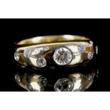 An 18ct yellow gold ring with platinum rubover set
