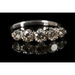 An 18ct white gold, 5 stone diamond ring. Total di