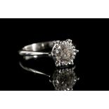 An 18ct white gold solitaire diamond ring, set wit