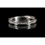 An 18ct white gold and diamond half eternity ring.
