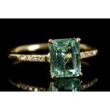 An 18ct gold, emerald and diamond ring, the claw s