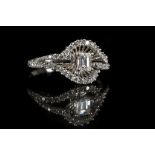 An 18ct white gold and diamond ring, the central e