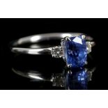 An 18ct white gold, sapphire and diamond ring, the