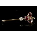 An antique high carat gold, garnet and diamond set