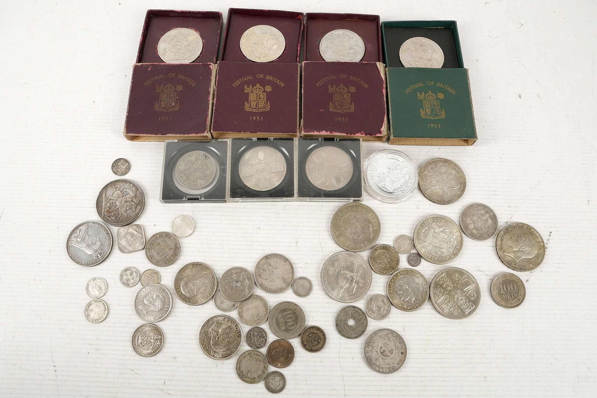 A collection of silver and cupro nickel coins to include two 1935 crown, N/C four 1951 crowns cased,