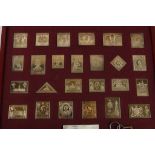 A collection of (25) twenty five silver gilt stamp replicas from the Royal collection, the issue