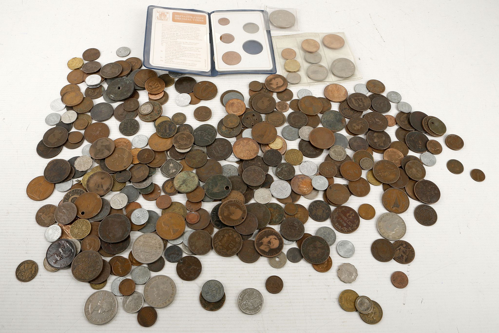 A collection of coins to include pennies, half pennies, sixpences, half crowns, Indian rupees,
