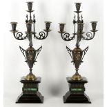 A pair of late 19th century bronze and ormolu, four light candlesticks, on black marble malachite