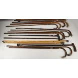 Walking sticks and canes, all with silver finial or band (15).