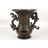 A Japanese bronze dragon base, Meiji period (1868-1912), decorated with scrolling clouds, with