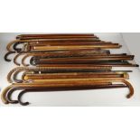 A bundle of walking sticks and canes, flask cane, continental and hardwood, goat and deer