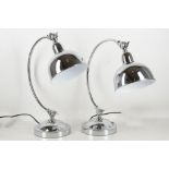 A pair of chrome desk lamps with adjustable dome shades (2).