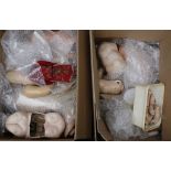 Two boxes of dolls body parts, including torsos, limbs and some heads (Qty).