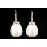 A pair of 18ct gold diamond and pearl drop earrings.
