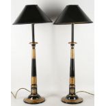 A pair of modern black and gilt lacquered table lamps with turned stem and shades, 73cm.