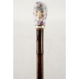 A fine 19th century bamboo vanity walking stick, the handle modelled in the Baroque taste with