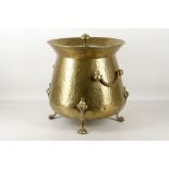 An Art Nouveau, plannished lidded coal pot, spade finial, spreading body, double handles, trifid