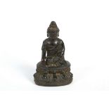 A JAPANESE BRONZE SEATED BUDDHA. 17TH/18TH Century. Seated on a double lotus base, 16cm H.