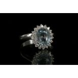An 18ct white gold, aquamarine and diamond cluster ring. Aquamarine: 2.44ct. Diamonds: 0.37ct. Size:
