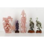 A collection of five Chinese hardstone carvings comprising; a large rose quartz carving of a lady,