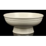 KEITH MURRAY FOR WEDGWOOD, an Art Deco earthenware pedestal bowl of ribbed form, covered in a