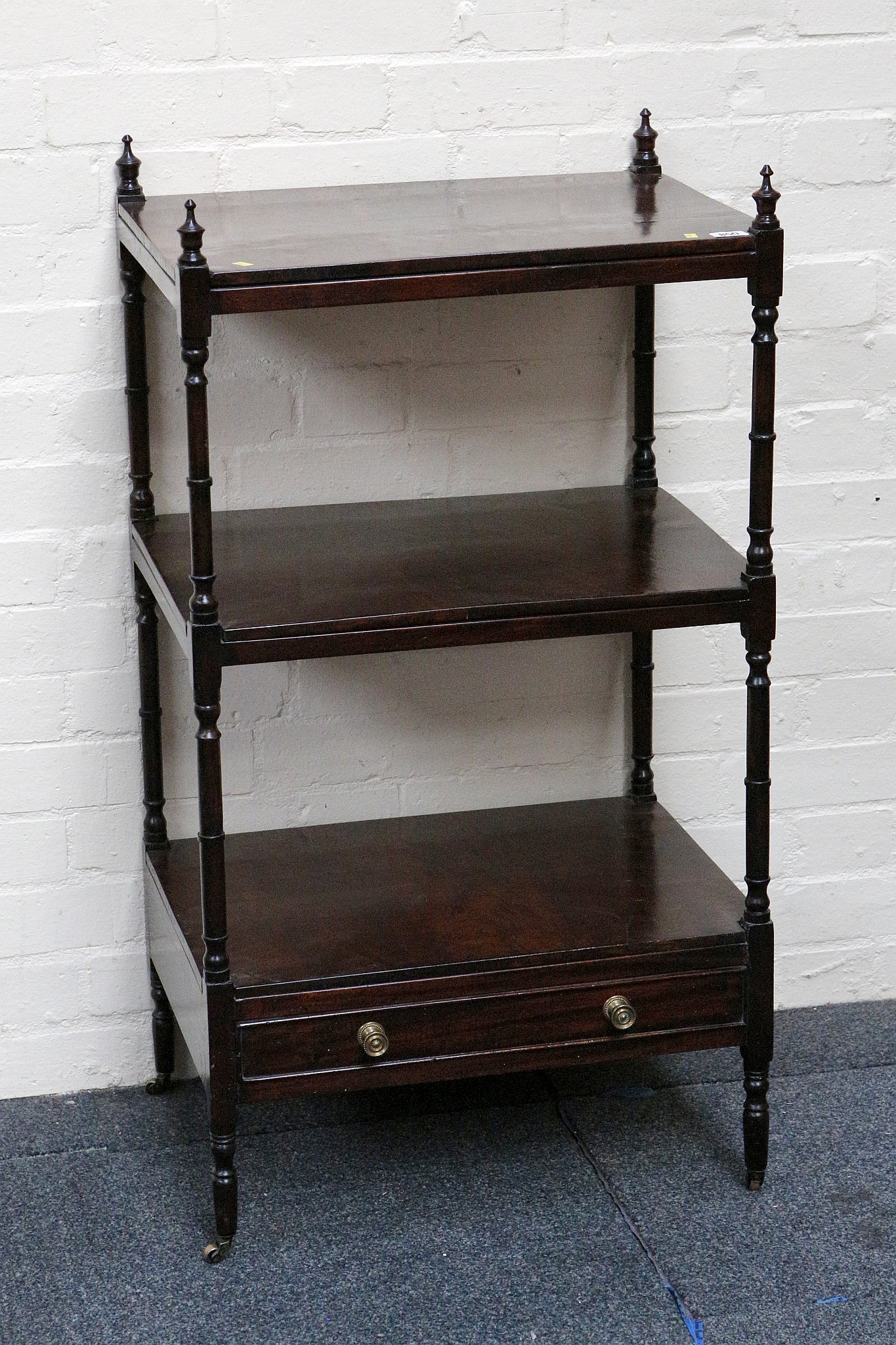 A 19th century mahogany what-not, with turned supports, three tiers and single drawer, 55 x 41cm.