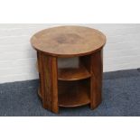 An Art Deco circular table, walnut, triple desk, canted supports, 55 x 61cm diameter.