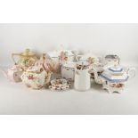 A large collection of teapots by various factories including Royal Doulton, Royal Worcester, Booths,