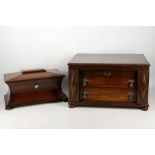 A 19th century sarcophagus shape tea caddy, mahogany with double boxes and mixer bowl, bun feet, and