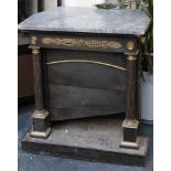 A 19th century Empire style cast iron and brass room heater.